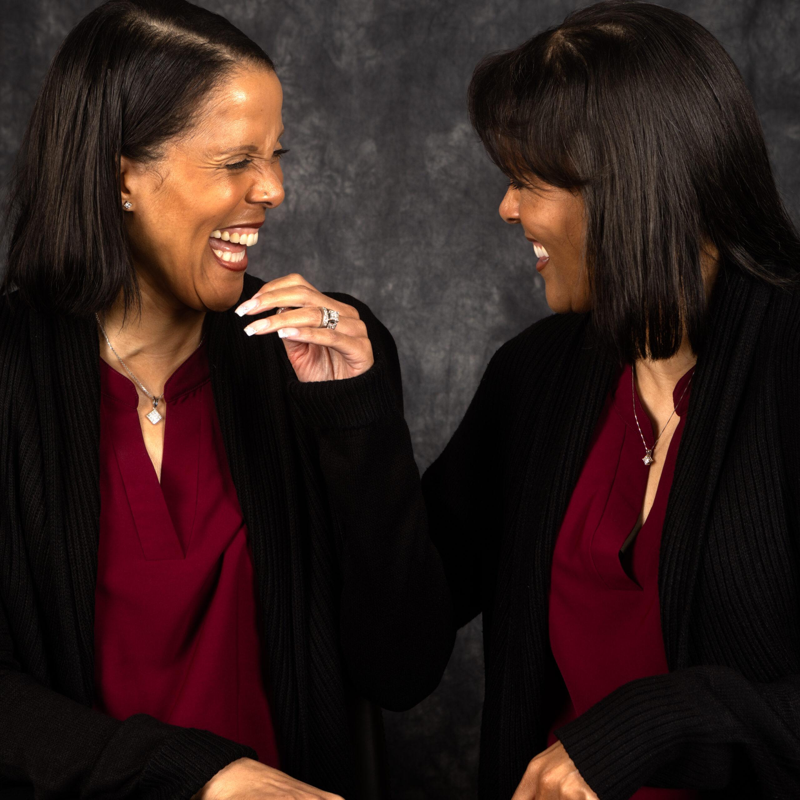 Twin sisters Joyce Malone and Jacintha Malone-Smith laugh together.