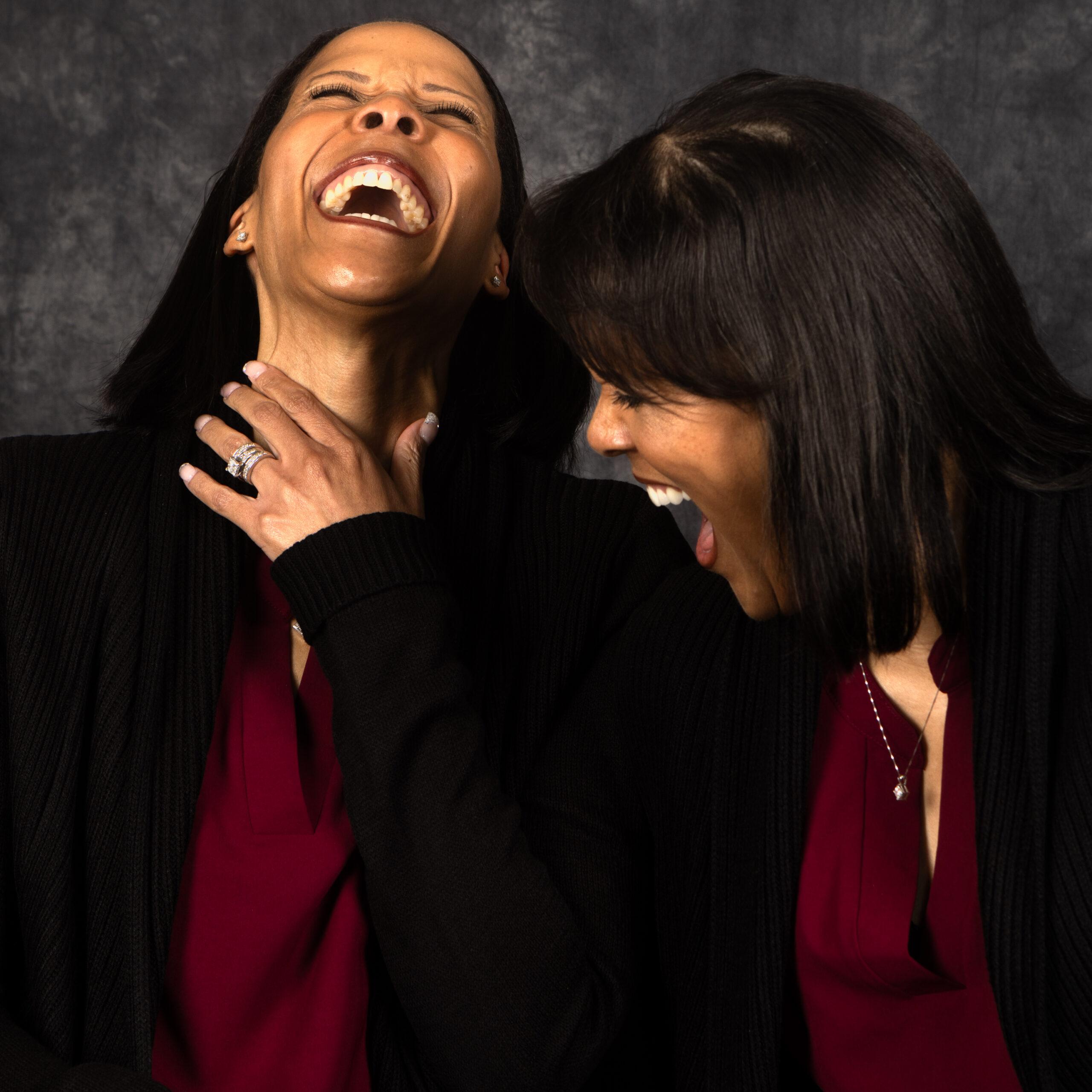 Twin sisters Joyce Malone and Jacintha Malone-Smith laugh together.