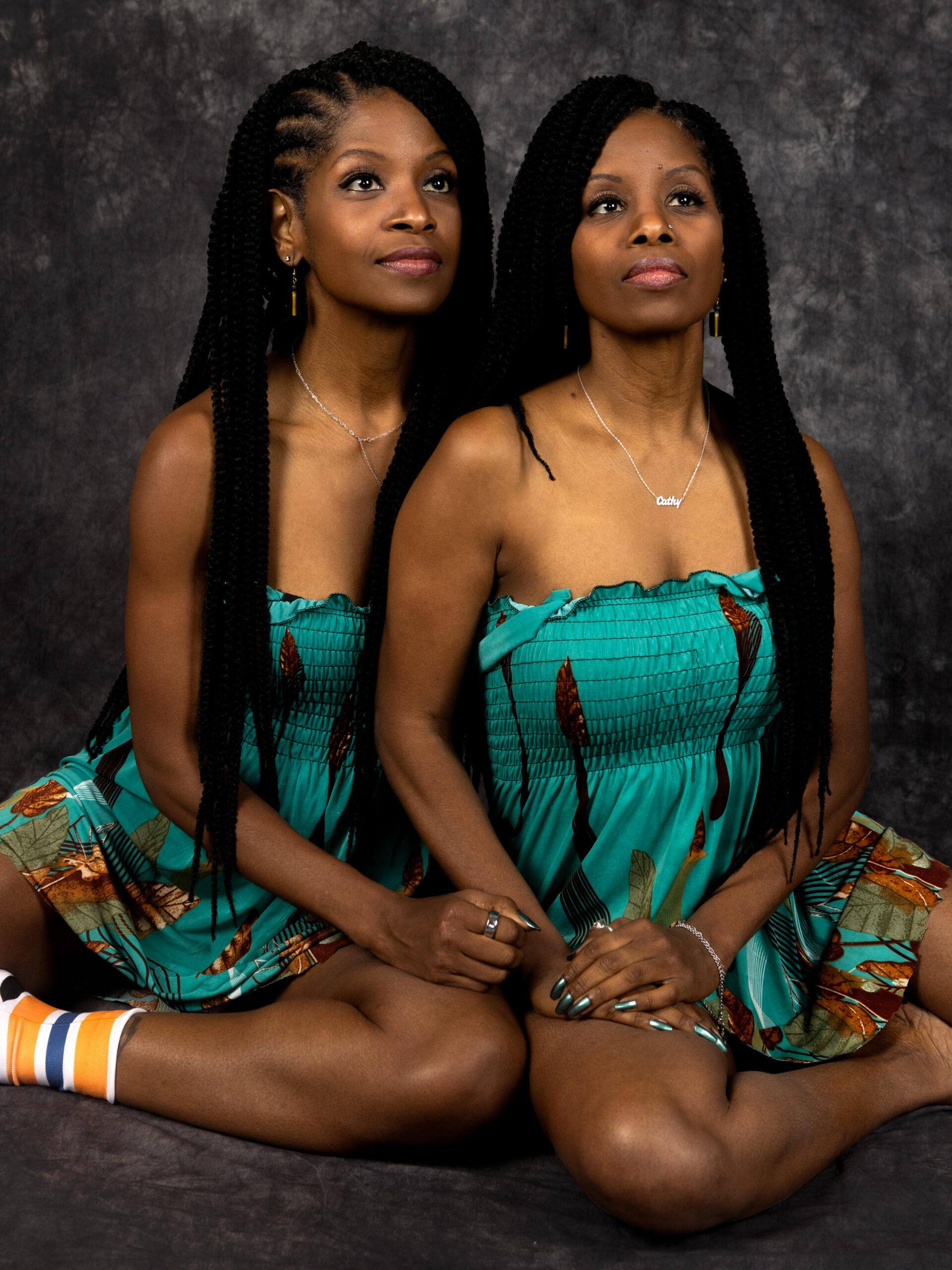 Twin sisters Carmelle and Cathy Jean-François embrace.